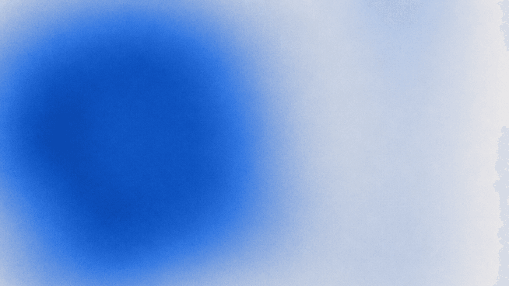 A soft blue orb of light emerging from grainy darkness