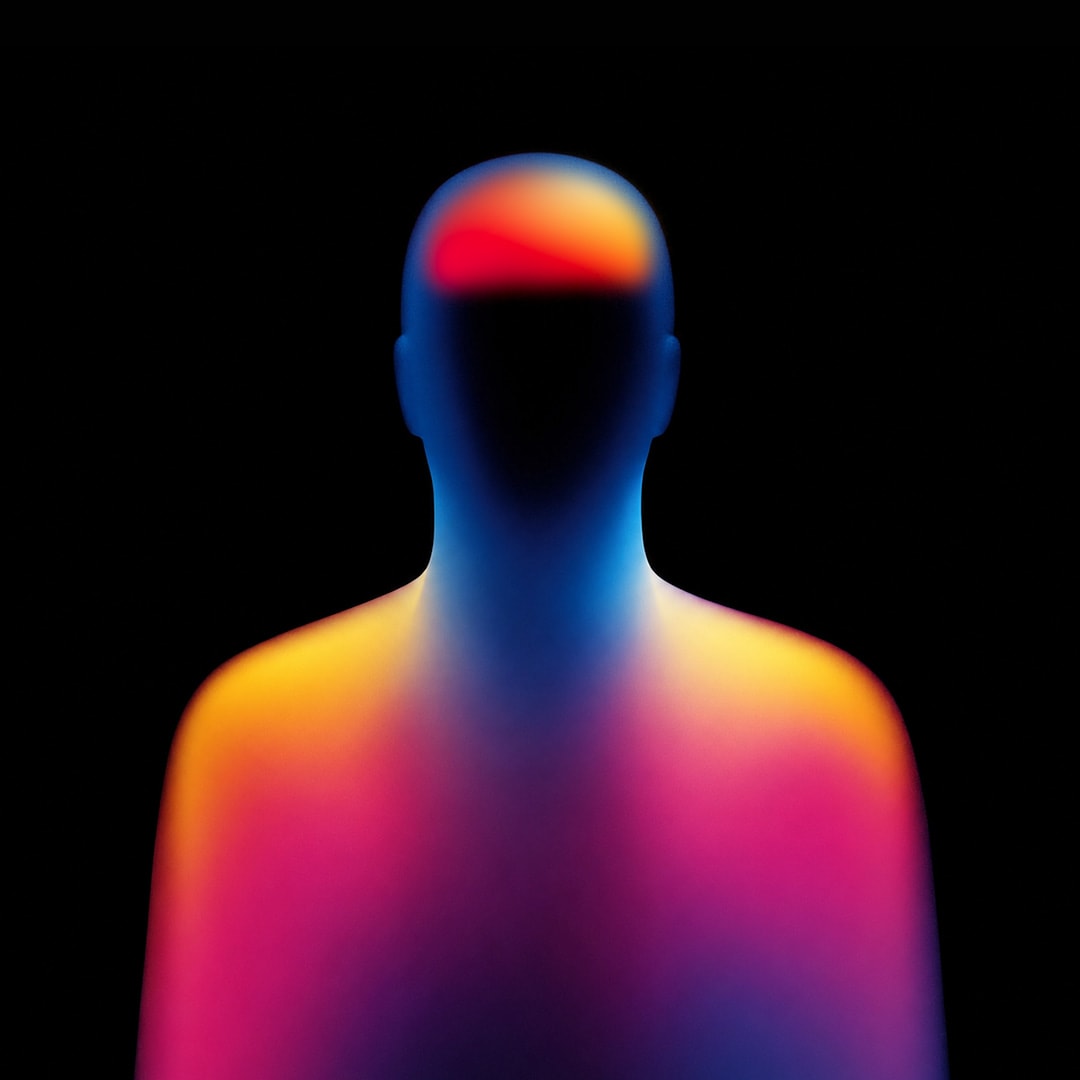 A thermal silhouette of a person with one region of the brain glowing red and amber